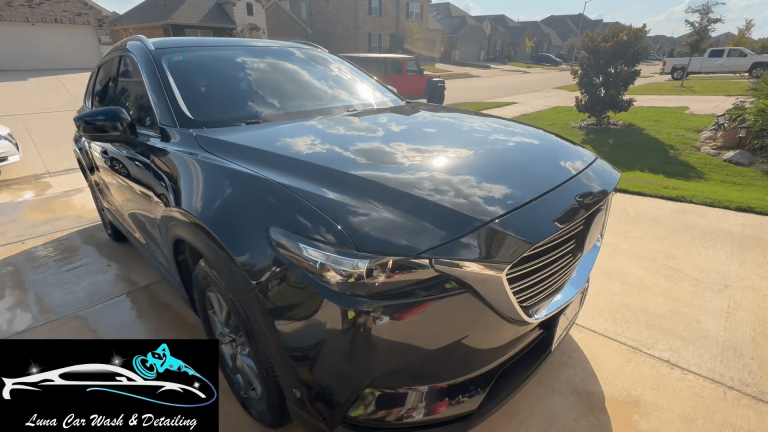 Black SUV after mobile exterior detailing service by Luna Car Wash & Detailing in the DFW Metroplex