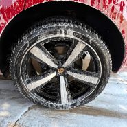 Foam-covered wheel and tire cleaning during mobile car wash service by Luna Car Wash & Detailing in DFW